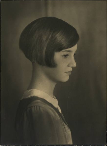 a young girl with a short bobbed hairstyle