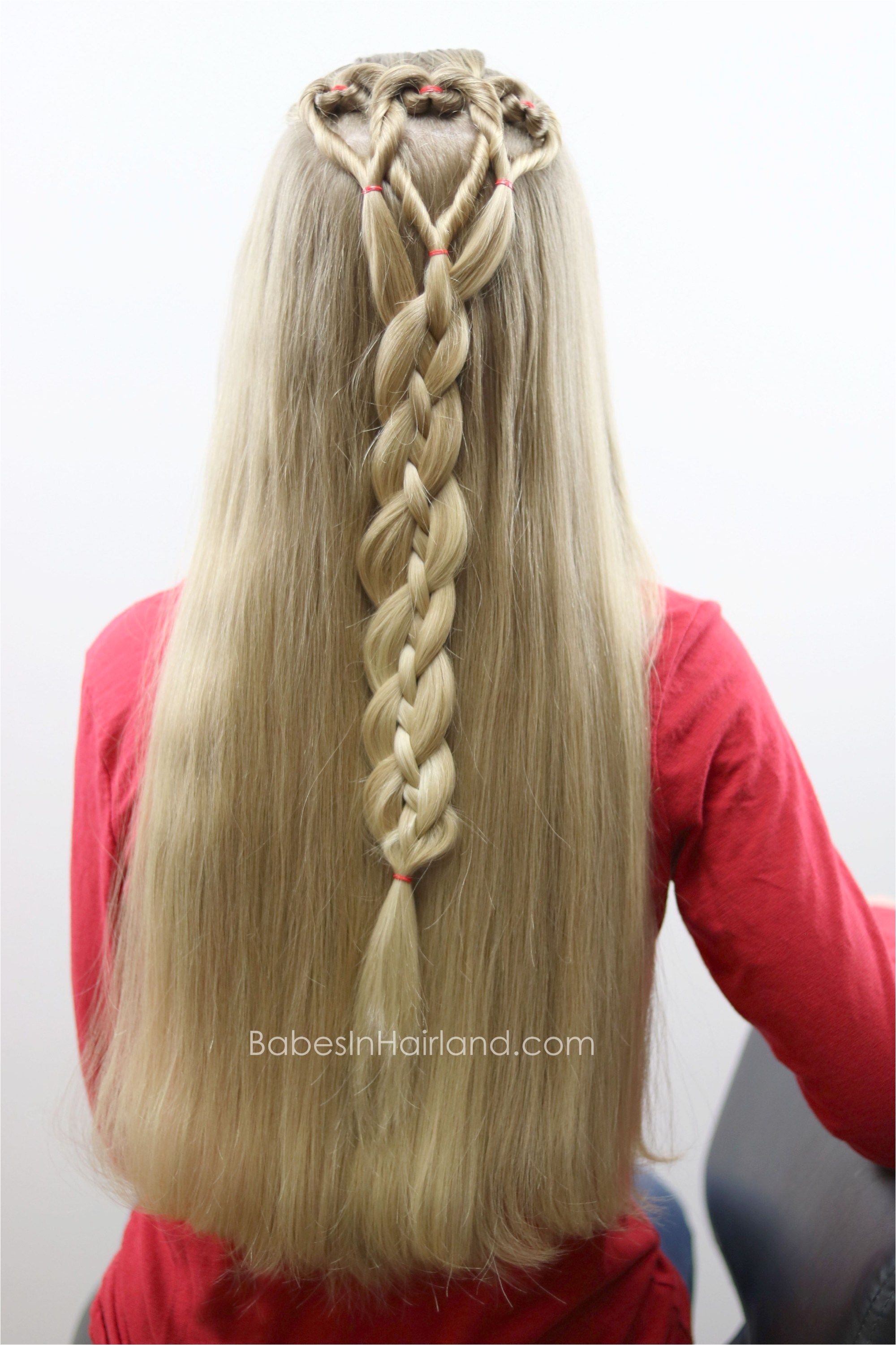 Three hearts are better than one We love this twisted heart and 4 strand braid hairstyle from BabesInHairland It s perfect for school Valentine s Day