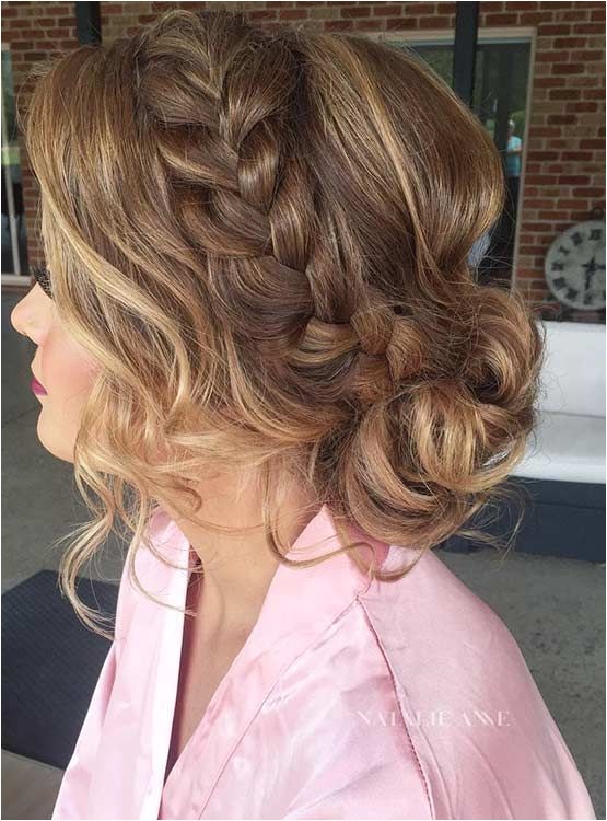 french braid into a messy low bun prom hair