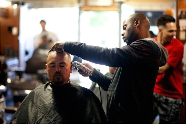 spirited discussions in a cramped barbershop aim to change minds and lives