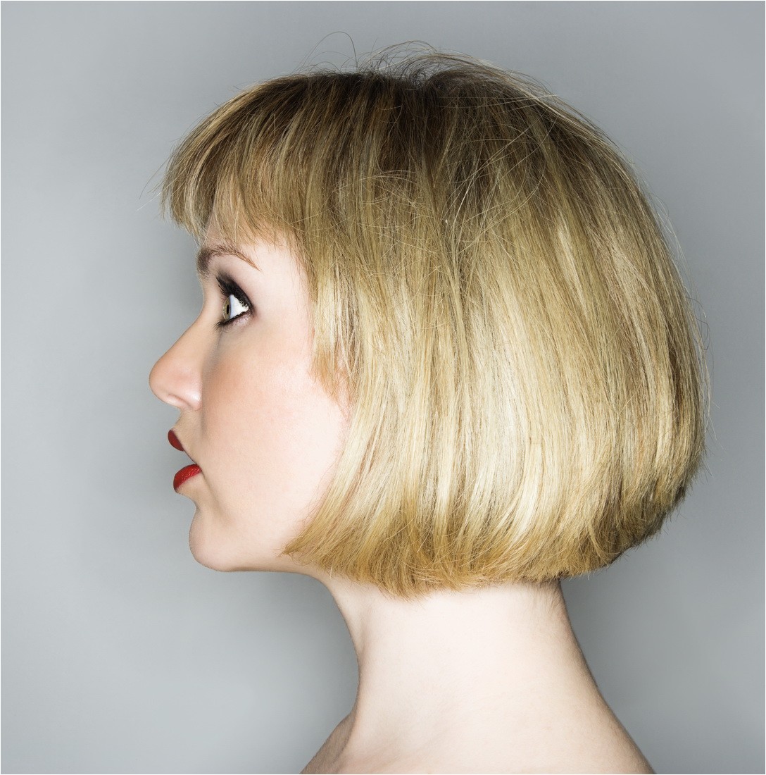 messy one length bob haircut with layered straight bangs