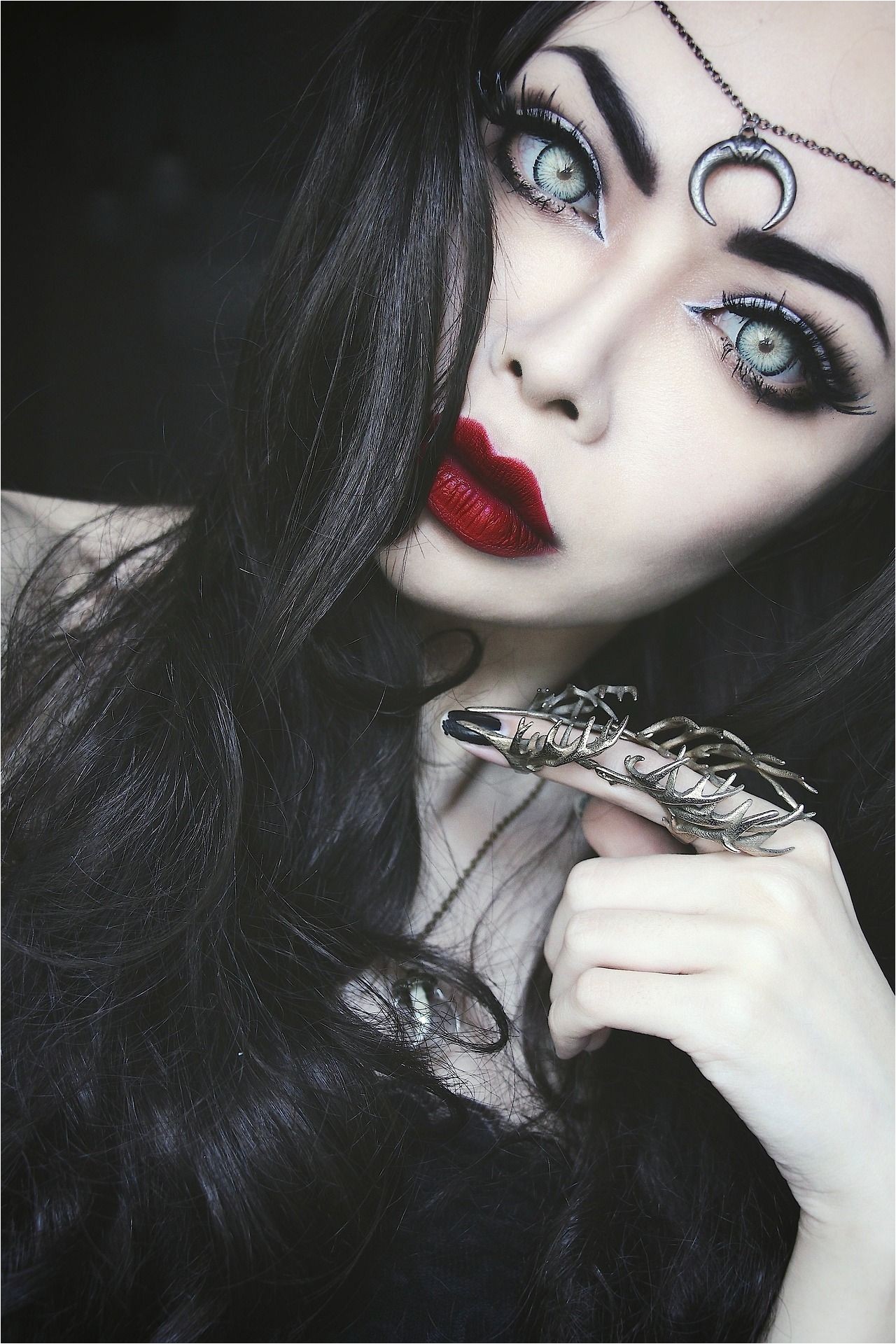 Another gothic makeup very bold features the eyes capture you massively along with the red bold lips and its amazing black hair