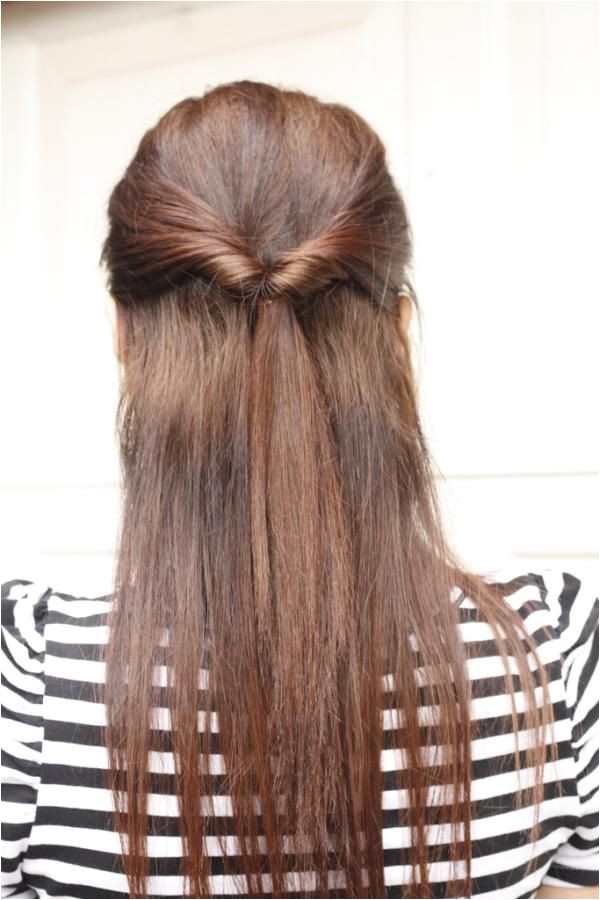 quick half up style for long straight hair tied by twisting in two bangs from front