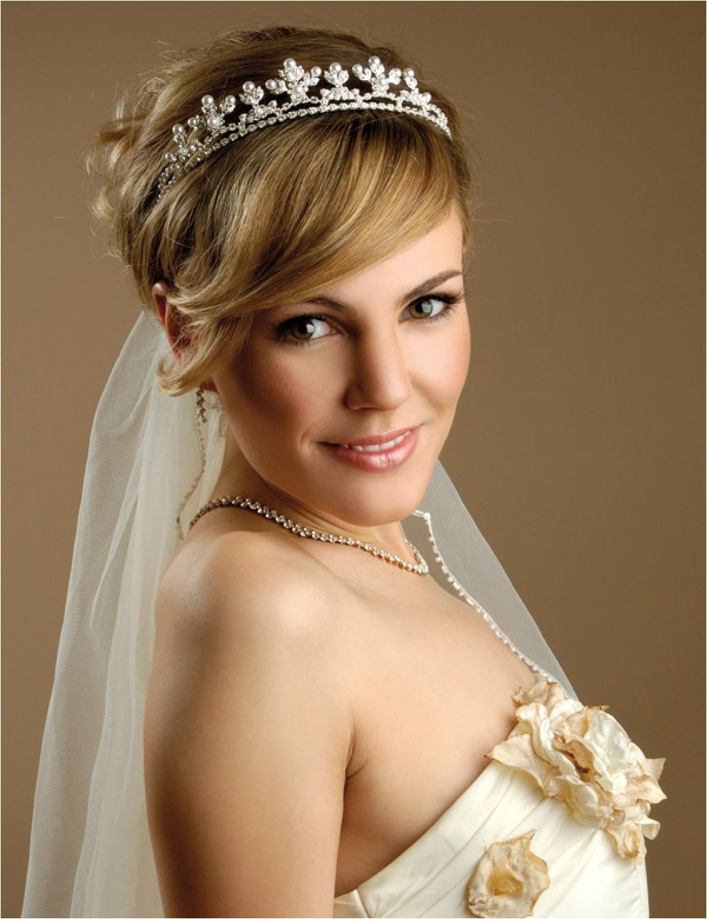 stylish hairstyle with long and short hairs with veil for wedding