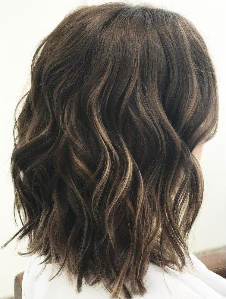 Medium Wavy Brunette Hairstyle