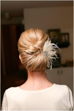 Updo hairstyle with feather fascinator Wedding dresses