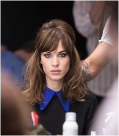 Alexa Chung Half Up Half Down hair 60s style hairstyle heavy bangs sideswept fringe Bangs Hairstyles