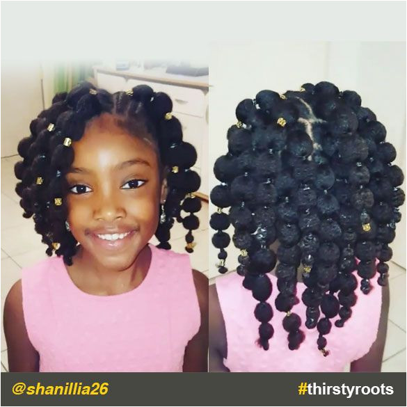 The caption for shanillia26 Instagram video says it all for this cute "hair puff balls" hairstyle for our little black girls "If you can t beat the