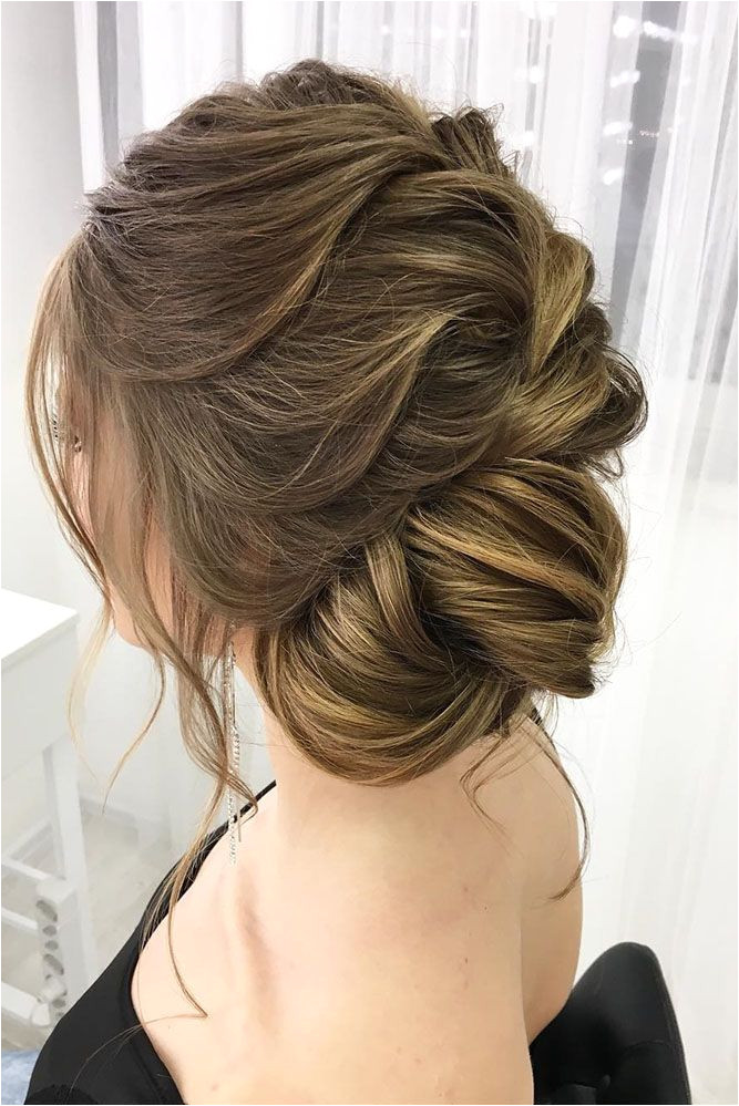 Bridal Hairstyles 30 Eye Catching Wedding Bun Hairstyles wedding bun hairstyles side bun oksan