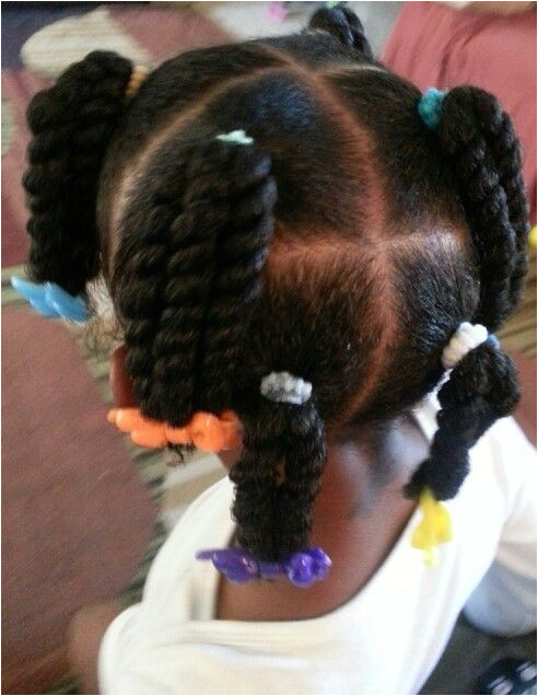 2 strand twist ponies first time wearing barrettes & she loves them