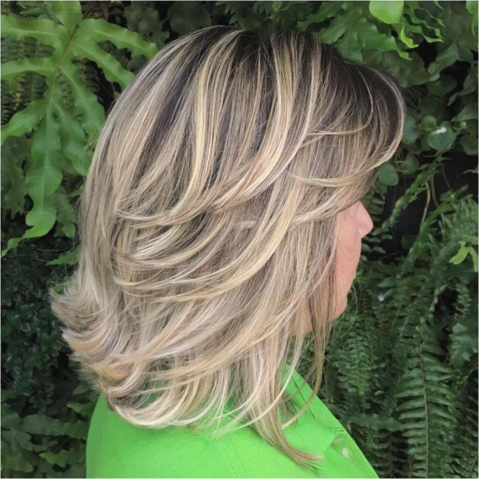 Mid Length Feathered Ash Blonde Hairstyle