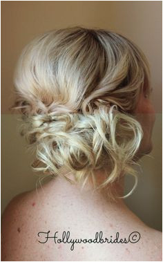 The Blonde hair shows off the texture of this adorable boho wedding hairstyle