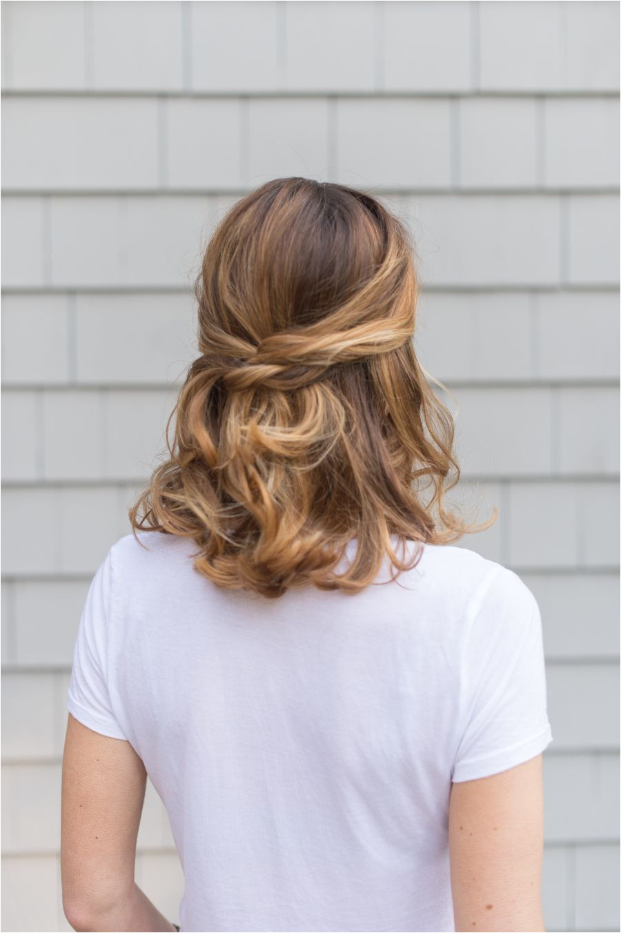 With the utility of a ponytail and the soft femininity of having your hair down this half up half down hairstyle is as perfect for every day life as it is