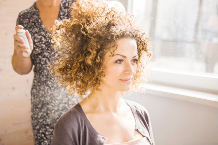 woman with curly hair at salon