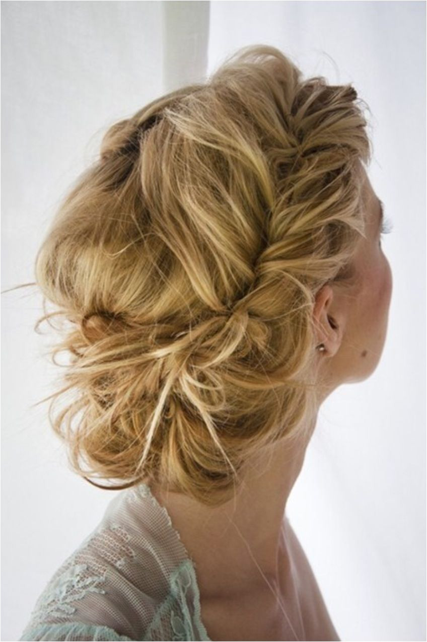 Prom hairstyle Fish tale braid into a messy bun