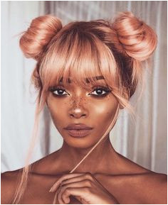 Say goodbye to the half up half down bun – double buns have officially taken over as the tren st cool girl hairstyle of the season