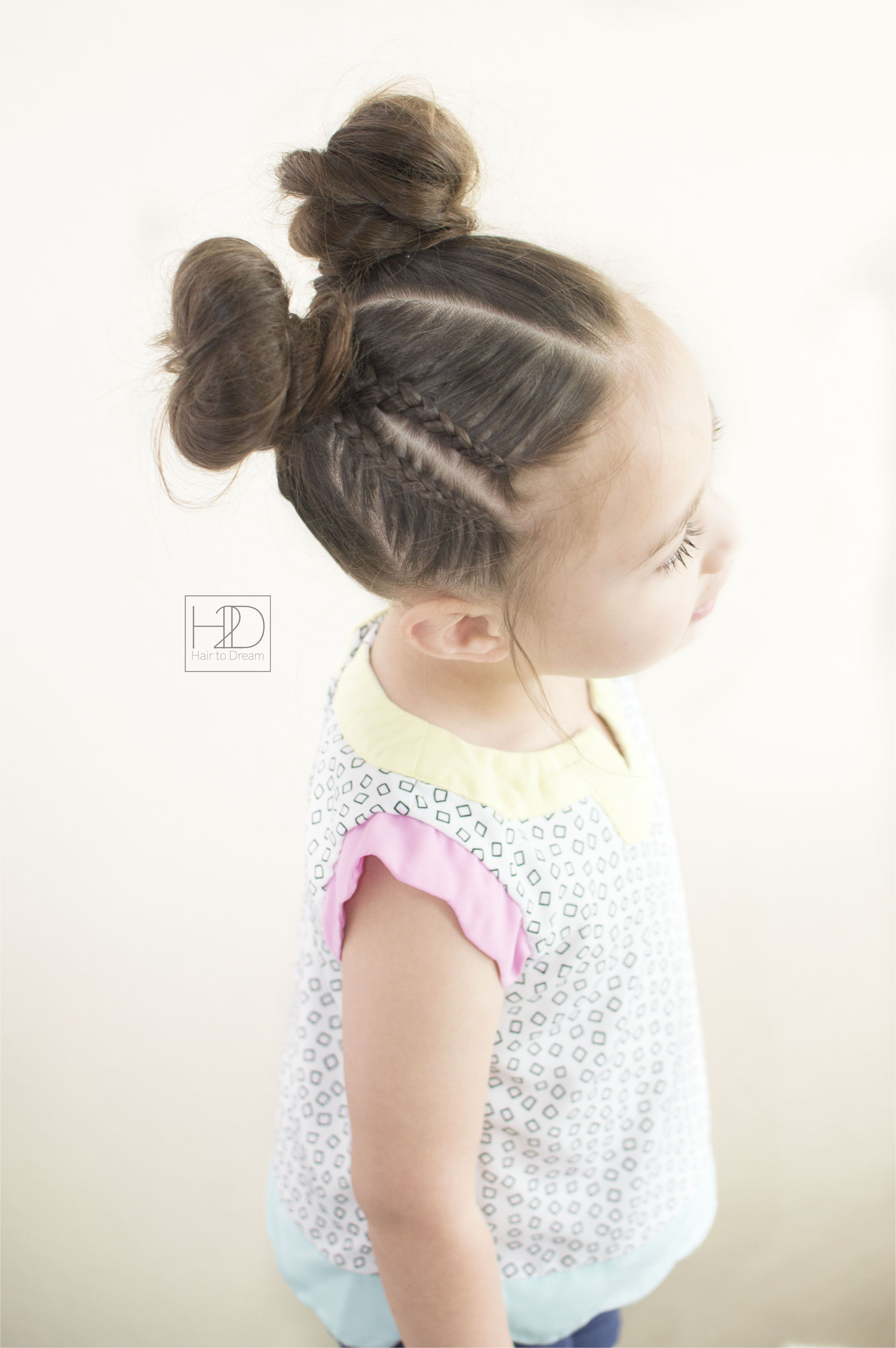 Lace braids and space buns hairstyle front view