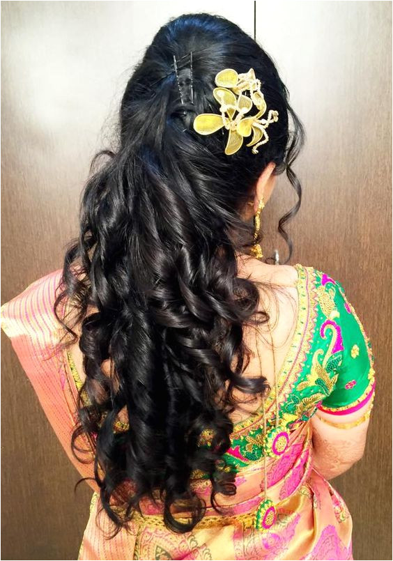Half up half open curly hairstyle for wedding