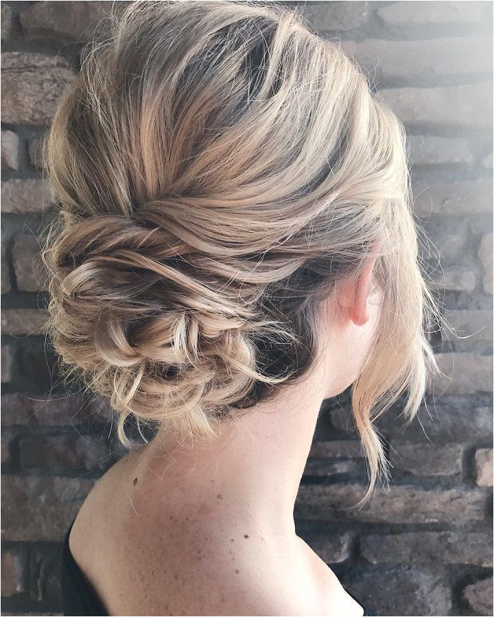 Messy textured updo bridal hairstyle