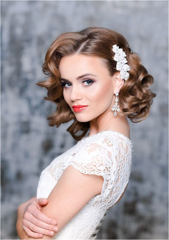 26 Short Wedding Hairstyles And Ways To Accessorize Them short curly bridal hair with a side pearl hairpiece to make a glam and girlish accent bridalhair