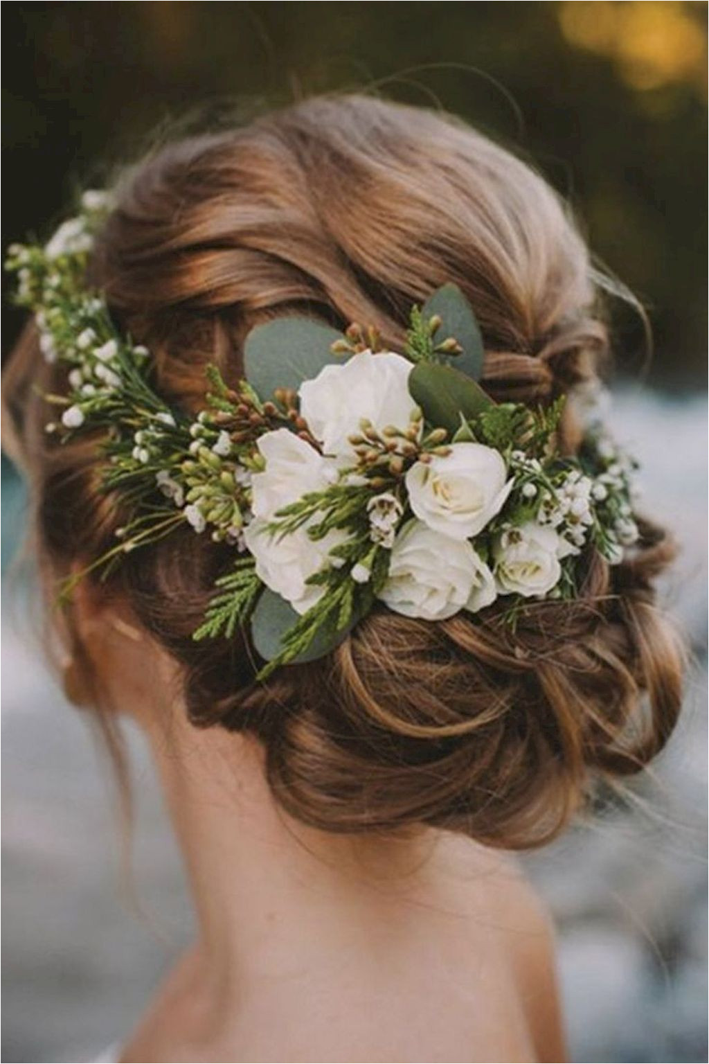 Flower crowns are a winning winter wedding hair accessory Maybe not quite this big of a piece but i like the greenery Nice 96 Bridal Wedding Hairstyles