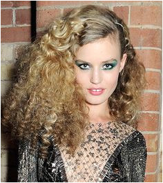 Rimmel face Georgia May Jagger stepped out with her hair styled in a massive cloud of tight ringlets a look that paired with her glittering embellished
