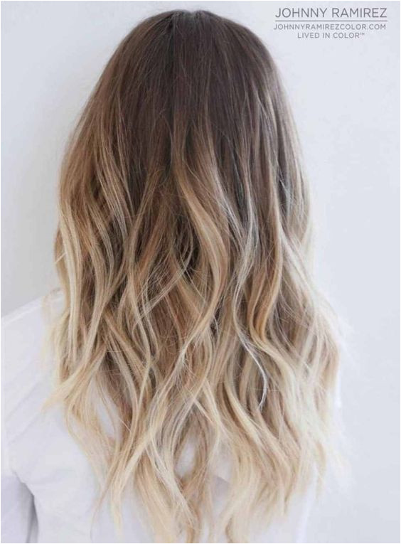 ombre blonde long curly hair hairstyle dark root