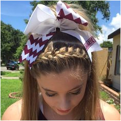 Braided high pony tail cheer hair Followed with a chevron name bow