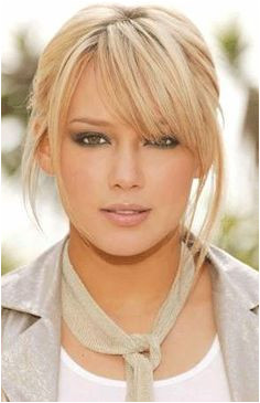 Cute bangs easy up hair great color with eyebrows the right tone so she doesn& look harsh love her look
