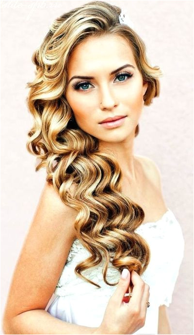 you are looking for a voluminous and timeless hairstyle for your big day you can never go wrong with this cascade of beautiful waves pinned to the side