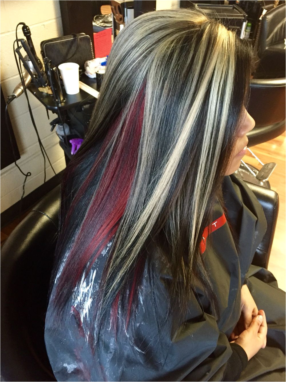 Chunky blonde highlights With all over black and a red halo