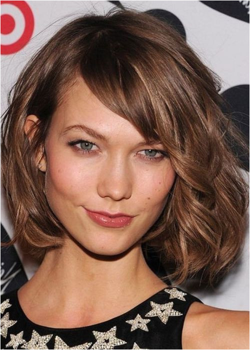 wavy tousled bob chin length side bangs"Ask for “a classic bob that s even in one length all the way around the neck but with long soft layers"