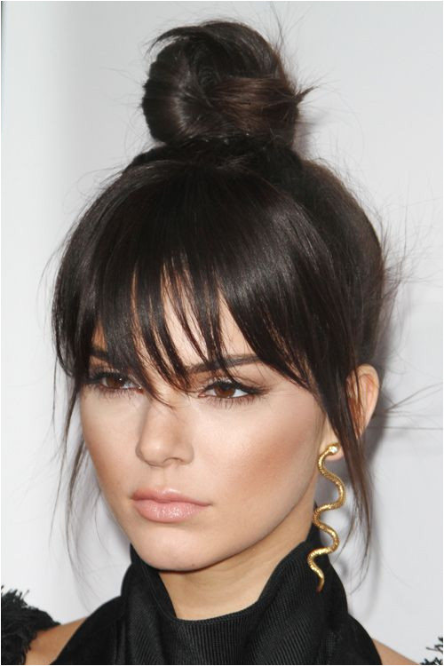 Kendall Jenner Straight Dark Brown Bun Choppy Bangs Hairstyle