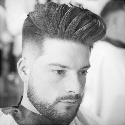 Picture of men s short haircut that s long on top with a drop fade