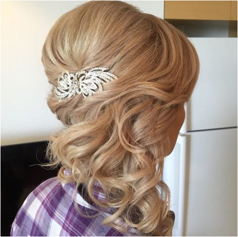 curly half updo with a bouffant long hairstyles