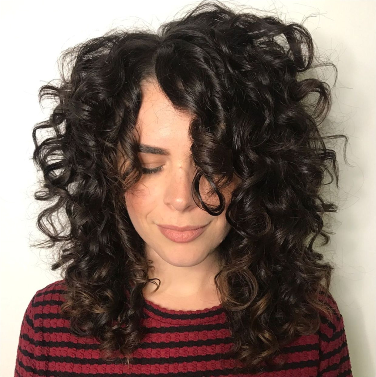 Mid Length Curly Hairstyle with f Centre Part