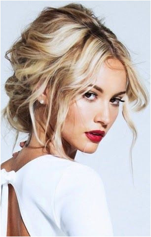 We love everything about this look the classic red lip and the tousled hair UpdosLoose