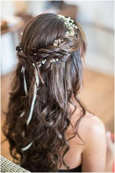 Beautiful mehendi hairstyle inspiration for brides Crown braid with half up half down