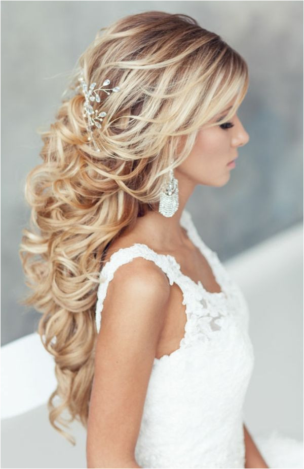 with gorgeous flowers we have created a beautiful collection of most romantic bridal updos for your wedding day Loose waves or a beautiful half up