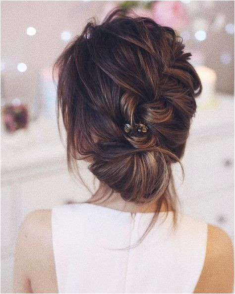 Beautiful braided and twisted updo wedding hairstyle for romantic brides Get inspired by this braid updo bridal hairstyle updo messy wedding hairstyles