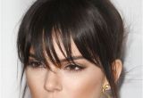 Black Hairstyles with Buns and Bangs Kendall Jenner Straight Dark Brown Bun Choppy Bangs Hairstyle