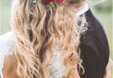 Wedding Hairstyles for Long Hair Down with Flowers Red Flower Detail In Wedding Hairstyle with Long Messy Waves